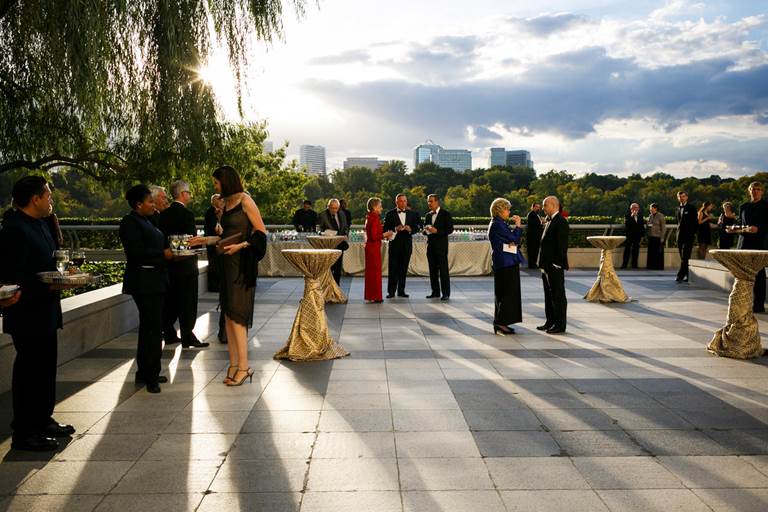 Guests enjoying a cocktail reception on the roof terrace of the Kennedy Center.